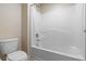 Bright and clean bathroom featuring a shower and toilet, perfect for everyday use at 1304 Independence Ln, Mount Dora, FL 32757