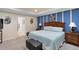 Spacious bedroom with a large bed and decorative wall art at 1304 Independence Ln, Mount Dora, FL 32757