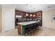 Well-equipped kitchen with stainless steel appliances and a large center island at 1304 Independence Ln, Mount Dora, FL 32757