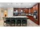 Spacious kitchen with granite counters, stainless steel appliances, and central island with seating at 1304 Independence Ln, Mount Dora, FL 32757