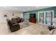 Cozy living room with tile flooring, neutral paint and multiple seating options at 1304 Independence Ln, Mount Dora, FL 32757