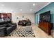 Inviting living room featuring tile flooring and a stylish accent rug at 1304 Independence Ln, Mount Dora, FL 32757