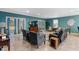 Open living room with tile floors, comfortable seating, and bright natural light at 1304 Independence Ln, Mount Dora, FL 32757