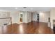 Spacious living room featuring hardwood floors, neutral paint, and access to the bathroom at 1304 Independence Ln, Mount Dora, FL 32757