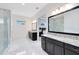 Modern bathroom features dual sinks with granite countertops and glass enclosed shower at 13349 Alderley Dr, Orlando, FL 32832