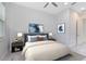 Bedroom with blue headboard, blue decor and cool-toned walls is brightly lit at 13349 Alderley Dr, Orlando, FL 32832