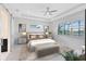 Bright bedroom with tray ceilings, recessed lighting, and large windows at 13349 Alderley Dr, Orlando, FL 32832