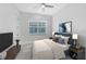 Well-lit bedroom features modern ceiling fan, area rug and stylish furniture at 13349 Alderley Dr, Orlando, FL 32832
