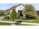 Lovely one-story home, showcasing lush greenery and a well-maintained lawn with beautiful landscaping at 13349 Alderley Dr, Orlando, FL 32832