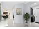 Hallway with decor and a view through doorway of kitchen and living spaces at 13349 Alderley Dr, Orlando, FL 32832