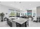 Bright open kitchen overlooks the living and dining area with backyard views at 13349 Alderley Dr, Orlando, FL 32832