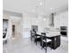 Bright, modern kitchen with white cabinetry, stainless steel appliances, and a central island with bar seating at 13349 Alderley Dr, Orlando, FL 32832