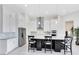 Bright open kitchen features a large island, stainless appliances, and white cabinets at 13349 Alderley Dr, Orlando, FL 32832