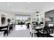 Bright open living and dining area features backyard views and sleek tile flooring at 13349 Alderley Dr, Orlando, FL 32832