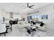 Bright open-concept living room featuring tile floors and sliding glass doors with golf course views at 13349 Alderley Dr, Orlando, FL 32832