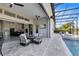 Spacious patio and outdoor kitchen with access to pool and backyard with views at 13349 Alderley Dr, Orlando, FL 32832