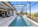 This screened pool with waterfall features is great for exercise and relaxation, along with an outdoor seating area at 13349 Alderley Dr, Orlando, FL 32832