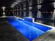 This screened pool is lit up at night for evening swimming and a relaxing hot tub, all surrounded by privacy at 13349 Alderley Dr, Orlando, FL 32832