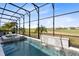 This beautiful screened pool and hot tub features a gorgeous golf course view with plenty of privacy at 13349 Alderley Dr, Orlando, FL 32832
