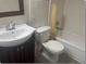 This bathroom features a tub, toilet, and vanity at 1415 Meadowlark St, Longwood, FL 32750
