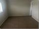 Bedroom featuring carpeted floors, neutral walls and a doorway to the hall at 1415 Meadowlark St, Longwood, FL 32750