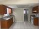 Functional kitchen featuring tiled floors, ample cabinet space, and a view into the next room at 1415 Meadowlark St, Longwood, FL 32750