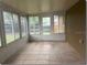 Bright sunroom with tile floor and multiple windows offering natural light at 1415 Meadowlark St, Longwood, FL 32750