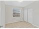 Simple bedroom featuring a bright window, closet, and neutral decor with ceramic tile floors at 1633 Colton, Orlando, FL 32822