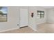 Inviting entryway features neutral tile flooring and a freshly painted front door at 1633 Colton, Orlando, FL 32822