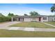 Charming single-story home with a well-maintained lawn, carport, and freshly painted exterior at 1633 Colton, Orlando, FL 32822