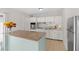 Bright kitchen featuring white cabinetry, granite countertops, and stainless steel refrigerator at 1633 Colton, Orlando, FL 32822