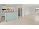 Open concept kitchen with tile floors, stainless steel fridge, and island seating at 1633 Colton, Orlando, FL 32822
