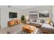 Inviting living room with a comfortable sofa, stylish rug, and abundant natural light at 1633 Colton, Orlando, FL 32822