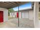 A charming patio area with brick pavers offers a private outdoor space, along with a red door at 1633 Colton, Orlando, FL 32822