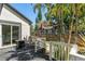 Private backyard view from the wood deck, showcasing lush landscaping, a fire pit and an adjacent home at 1638 Mount Vernon St, Orlando, FL 32803