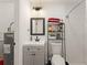 Bright bathroom features a modern vanity, subway tile shower, and convenient shelving for toiletries at 1638 Mount Vernon St, Orlando, FL 32803
