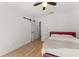 Bright bedroom featuring wood floors and a sliding barn door at 1638 Mount Vernon St, Orlando, FL 32803