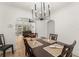 Bright dining room features modern chandelier, dining table, and access to living room at 1638 Mount Vernon St, Orlando, FL 32803