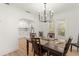 Bright dining room features modern chandelier, dining table, and access to kitchen and natural light at 1638 Mount Vernon St, Orlando, FL 32803