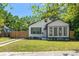 Charming home featuring well-manicured lawn, a decorative window awning, and a partial fence, enhancing its curb appeal at 1638 Mount Vernon St, Orlando, FL 32803