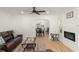 Bright living room featuring hardwood floors, neutral paint and a fireplace at 1638 Mount Vernon St, Orlando, FL 32803
