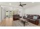 Open living room with hardwood floors, neutral paint, ceiling fan and lots of natural light at 1638 Mount Vernon St, Orlando, FL 32803