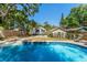 Lush backyard featuring a pool, complemented by an outdoor patio with a table, perfect for entertaining and relaxation at 1638 Mount Vernon St, Orlando, FL 32803