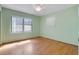 Bedroom with hardwood floors, natural light from window and potential for updates at 1807 Yorkshire Dr, Winter Park, FL 32792
