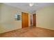 Bedroom with wooden floor, ceiling fan, and a built-in mirrored closet at 1807 Yorkshire Dr, Winter Park, FL 32792