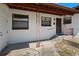 A covered front porch with ornate metal supports and a pathway to the side door at 1807 Yorkshire Dr, Winter Park, FL 32792