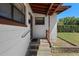 A cozy front porch with stone steps leads to the entryway at 1807 Yorkshire Dr, Winter Park, FL 32792