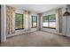 Bright living room area featuring three large windows with floral curtains at 1807 Yorkshire Dr, Winter Park, FL 32792
