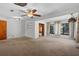 Spacious living room featuring neutral carpet and ceiling fans at 1807 Yorkshire Dr, Winter Park, FL 32792