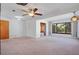 Spacious living room with ceiling fan, and sunroom featuring large window with natural light at 1807 Yorkshire Dr, Winter Park, FL 32792